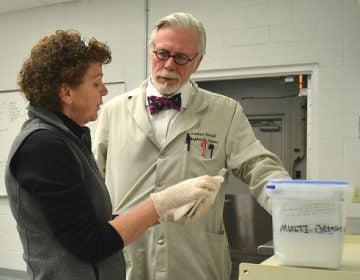 Dauphin County Coroner Graham Hetrick and Assistant Chief Deputy Coroner Lynn Choborda discuss blood test results. Like many Pennsylvania counties, Dauphin has had a steady increase in drug overdose deaths. (Brett Sholtis/Transforming Health)