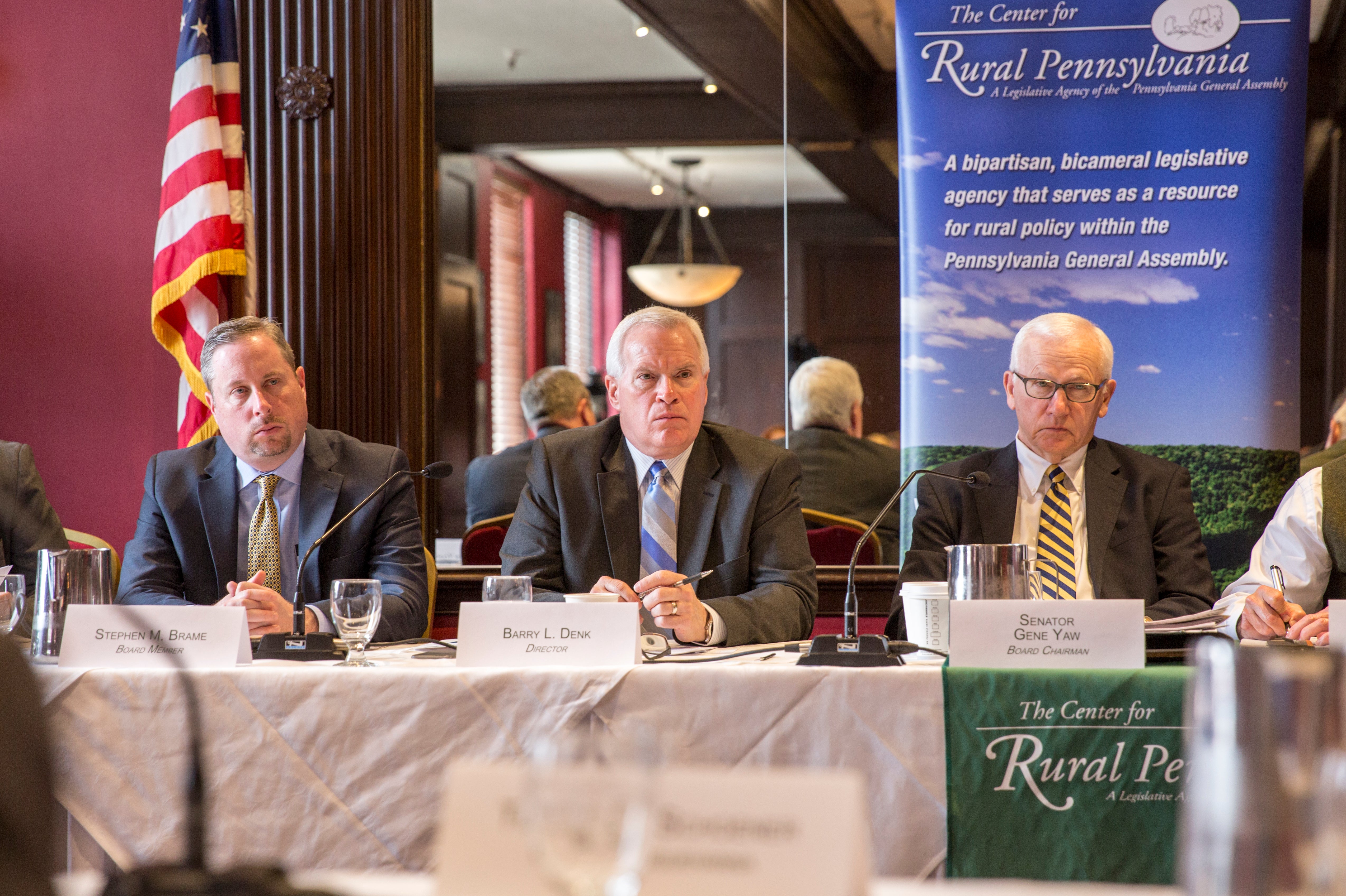 Barry Denk (center) and Sen. Gene Yaw (right) heard from providers and consumers.