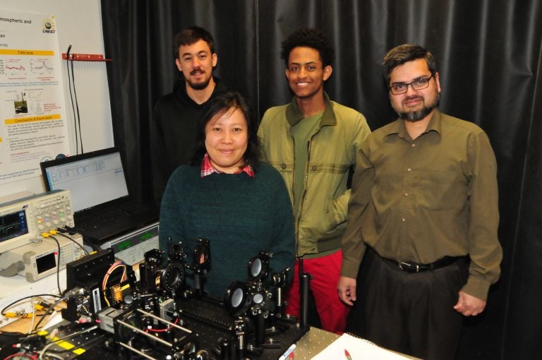 DSU researchers Caio Azevedo, a junior from Brazil; May Hlaing, a doctoral student from Myanmar; Luil Menberu, a sophomore from Ethiopia; and Dr. Mohammad Khan will develop a chemical weapon sensing laser with grant funds from the Department of Defense. (Courtesy DSU)