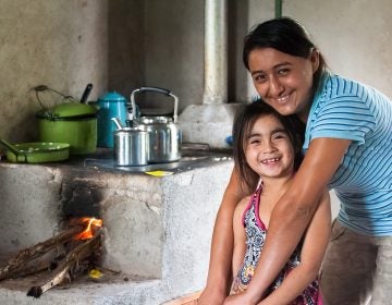 Many communities rely on inefficient and dirty wood fired stoves to cook. A common carbon offset project is to supply communities with cleaner, more efficient stoves. For recipients, like this family in Honduras, it saves time and money, as well as carries health benefits. (Courtesy of Cool Effect) 