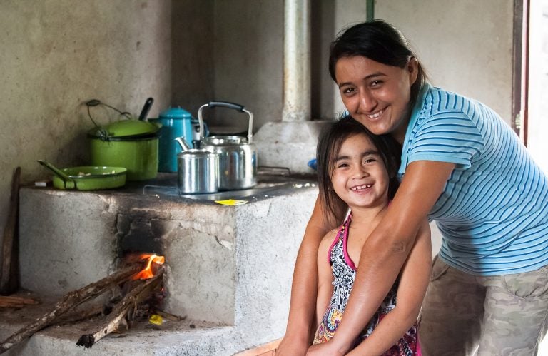 Many communities rely on inefficient and dirty wood fired stoves to cook. A common carbon offset project is to supply communities with cleaner, more efficient stoves. For recipients, like this family in Honduras, it saves time and money, as well as carries health benefits. (Courtesy of Cool Effect) 