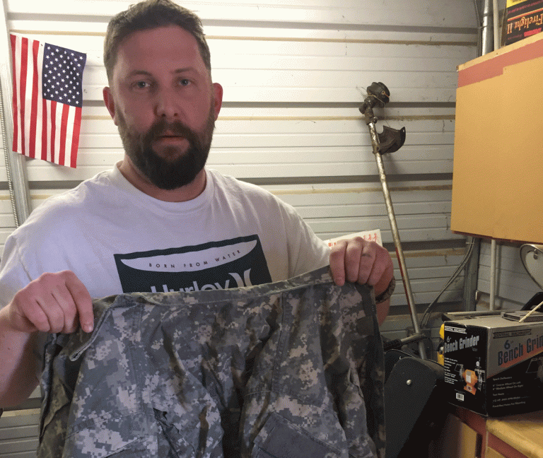 Veteran Thomas Fitzinge holding his uniform. (Provided)