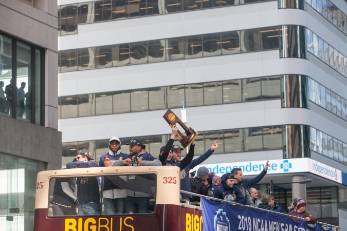 The NCAA Champion Villanova WIldcats basketball team ride down Market Street during their parade Thursday morning. (Brad Larrison for WHYY)