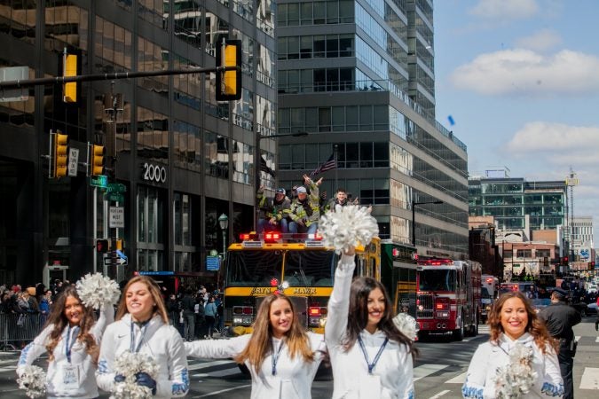 The Bryn Mawr Fire Department rides down Market Street ahead of the NCAA Champion Villanova WIldcats Thursday morning. (Brad Larrison for WHYY)