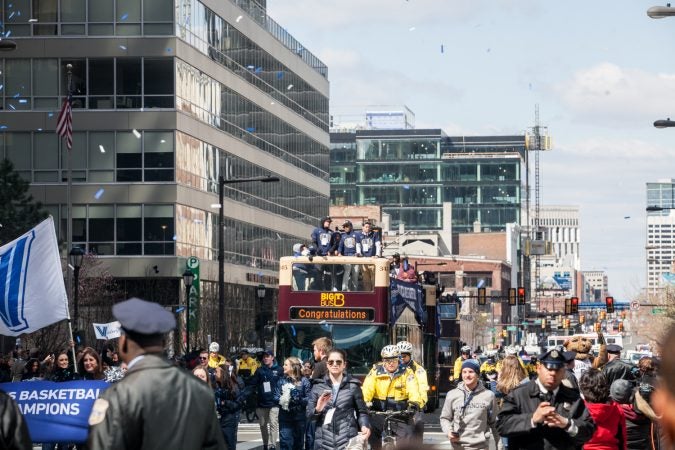 The NCAA Champion Villanova WIldcats basketball team ride down Market Street during their parade Thursday morning. (Brad Larrison for WHYY) parade Thursday morning. (Brad Larrison for WHYY) parade Thursday morning. (Brad Larrison for WHYY)