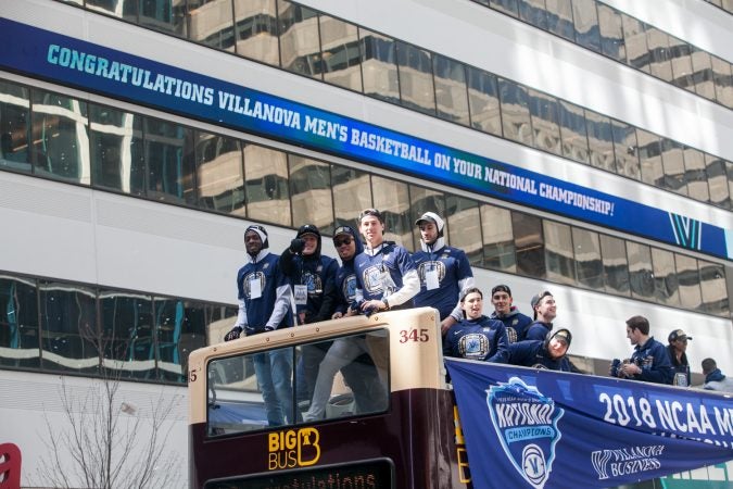 The NCAA Champion Villanova WIldcats basketball team ride down Market Street during their parade Thursday morning. (Brad Larrison for WHYY) parade Thursday morning. (Brad Larrison for WHYY)