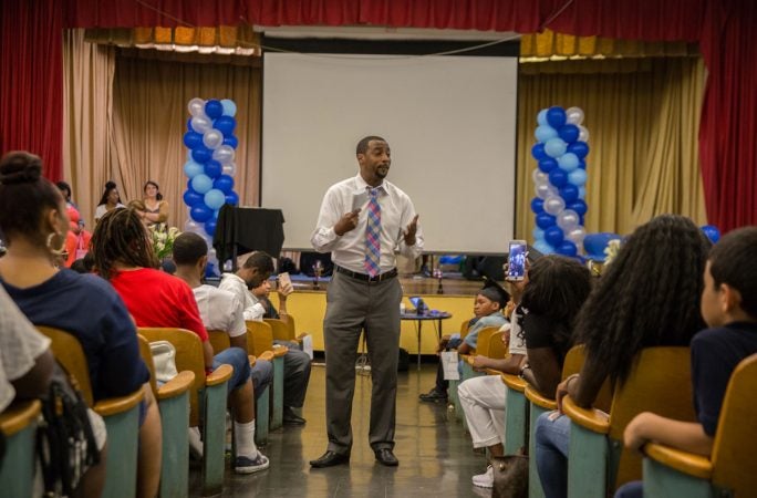 Jovan speaks to students and parents to conclude graduation. 