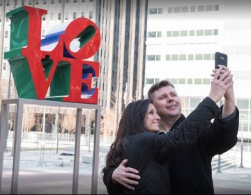 A couple poses at Love Park in February.  (Courtesy of Philadelphia Department of Parks and Recreation)