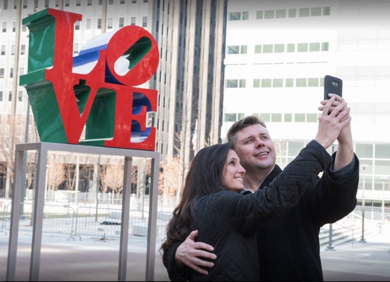 A couple poses at Love Park in February.  (Courtesy of Philadelphia Department of Parks and Recreation)