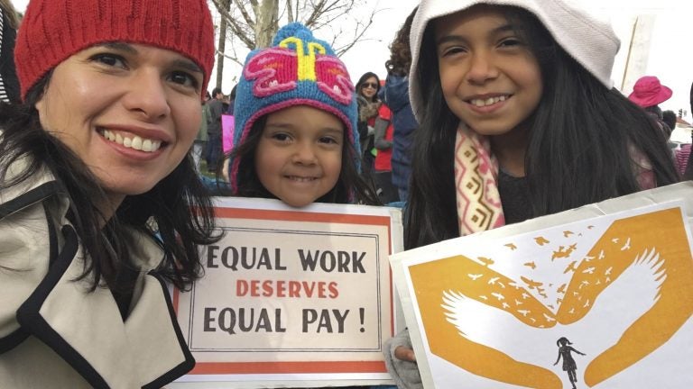 A federal court has sided with Aileen Rizo, who filed suit after realizing her male counterparts were being paid more. The ruling overrules a previous interpretation of the 1963 Equal Pay Act. Rizo is seen here with her daughters in a photo she provided to the AP in 2017. (Aileen Rizo/AP)