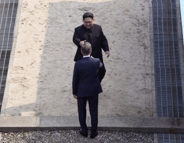 Kim approaches to shake hands with Moon at the border village of Panmunjom in the Demilitarized Zone, South Korea, on Friday. Hand out, North Korean leader Kim Jong Un approaches South Korean President Moon Jae-in at the border village of Panmunjom in the Demilitarized Zone on Friday. (Korea Summit Press Pool via AP)