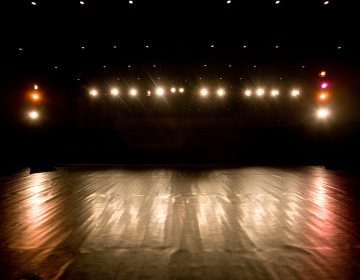 spotlights and reflections on a modern theater stage