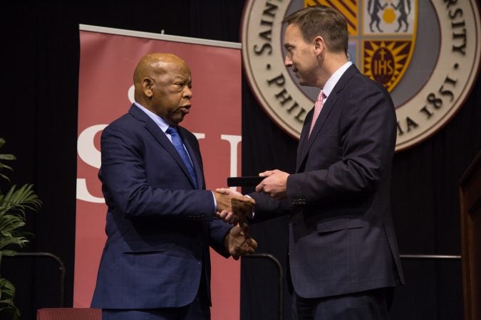 St. Joe's president, Mark C. Reed, presents Rep. John Lewis with the President's Medal of Excellence on April 16th 2018.