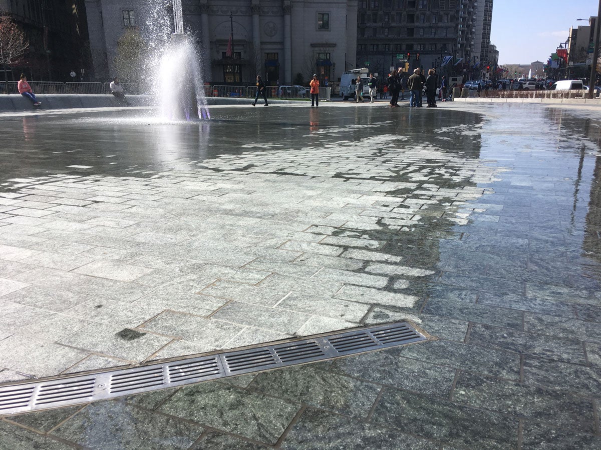 During initial testing of LOVE Park's new water features, water flowed around the drains and onto sidewalks that were meant to remain dry