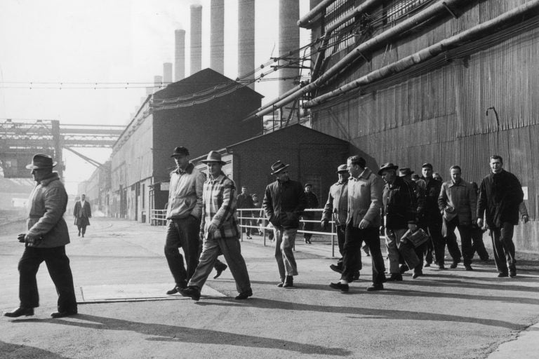 Steelworkers leave a plant at the end of their shift in Bethlehem, Pa., in 1947. Employment in the industry has declined by 80 percent from its peak six decades ago, according to author Douglas Irwin. (Hulton Archive/Getty Images)