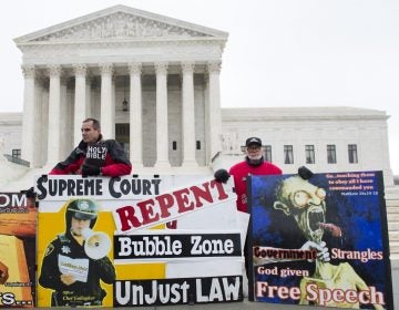 Anti-abortion-rights demonstrators stand outside the U.S. Supreme Court in 2014 after oral arguments over buffer zones around abortion clinics. (Saul Loeb/AFP/Getty Images)