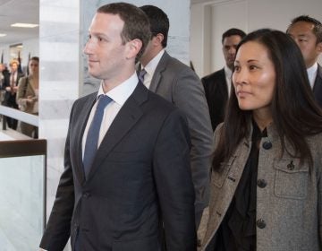 Facebook CEO Mark Zuckerberg and his wife, physician and philanthropist Priscilla Chan (right), on Capitol Hill on Monday. Zuckerberg has accepted the blame for security lapses at the world's largest social network  as he girded for appearances this week before angry lawmakers