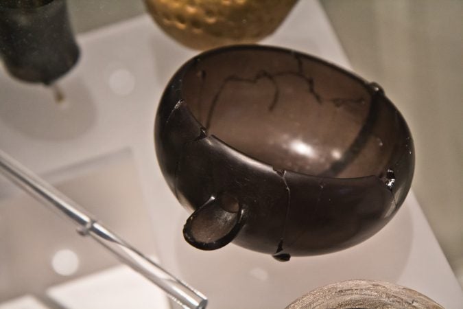 A bowl made of obsidian (volcanic glass) found at an excavated home in Tepe Gawra, modern day Iraq, 4300 BCE. (Kimberly Paynter/WHYY)