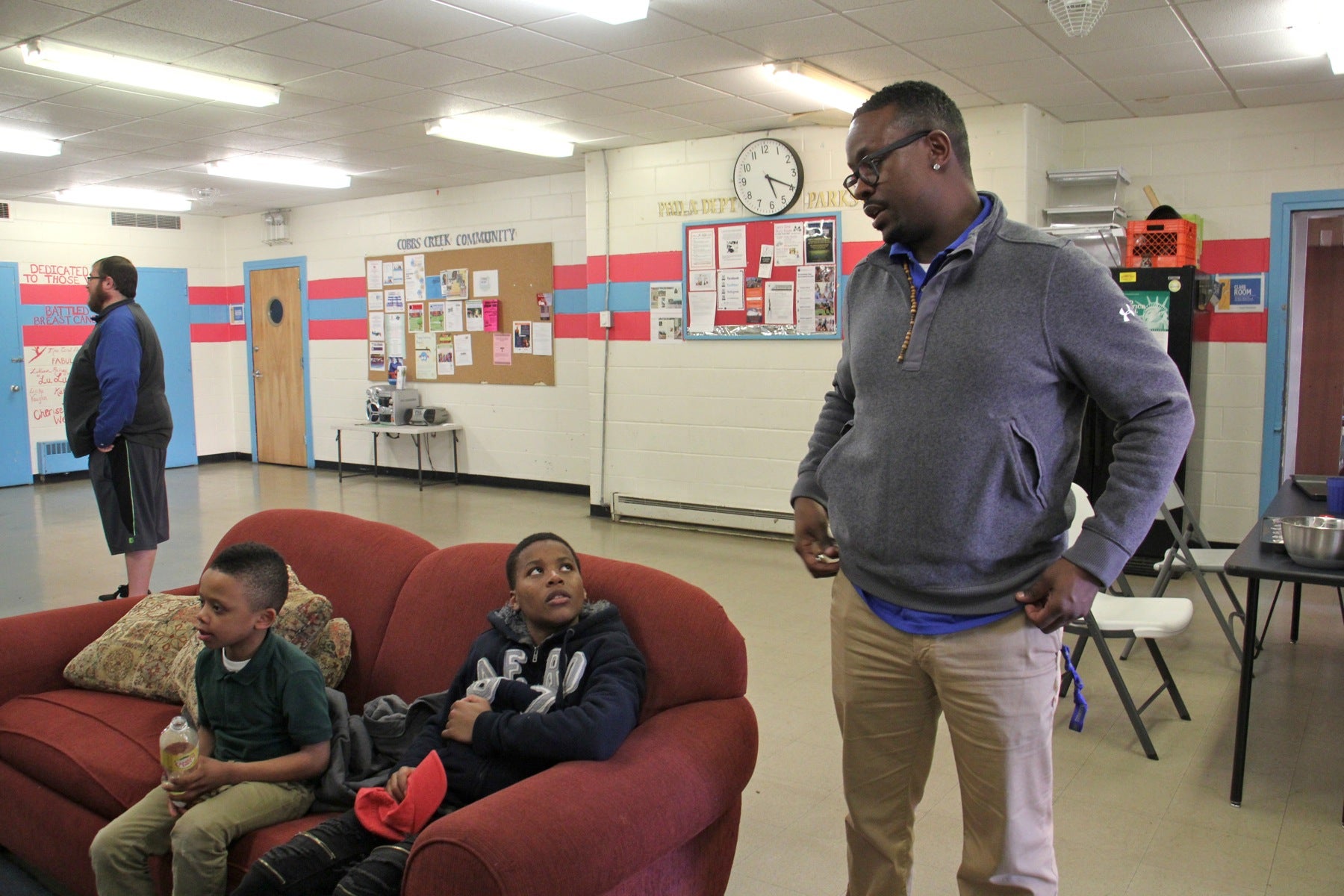 Trainie Quan King stops to chat with some youngsters at the Cobbs Creek Rec Center. (