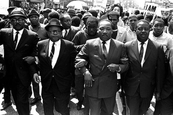 The Rev. Ralph Abernathy, right, and Bishop Julian Smith, left, flank Dr. Martin Luther King, Jr., during a civil rights march