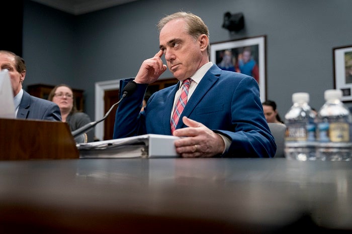 Veterans Affairs Secretary David Shulkin, center, arrives for a House Appropriations subcommittee hearing on Capitol Hill in Washington, Thursday, March 15, 2018. (AP Photo/Andrew Harnik)