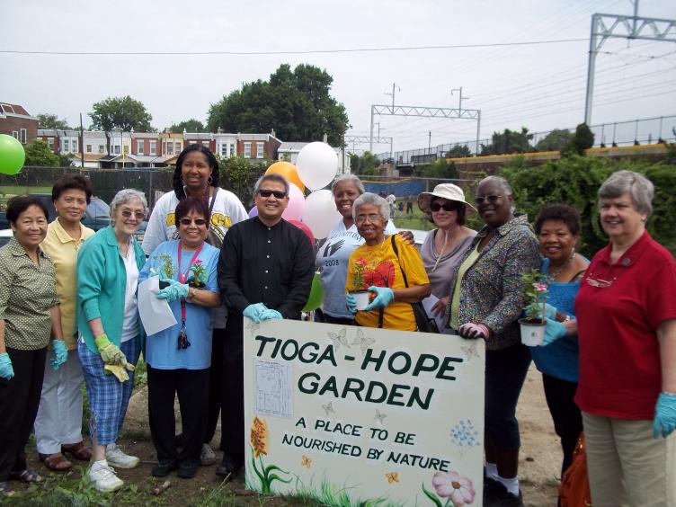 Tioga-Hope gardeners gather at the community plot they hope to buy from the city. (Photo courtesy of Tioga-Hope Garden)