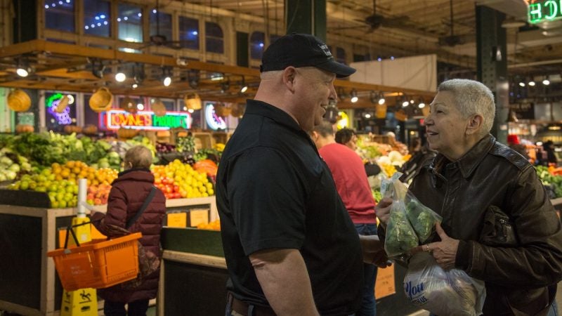 Jimmy Iovine chats with longtime shopper Donna Shovlin of Villanova. “It's so economical to shop here. They care about what they put come. I come in every week or whenever I'm in town to say hello. They're like family they look after us,” she says. (Emily Cohen for WHYY)