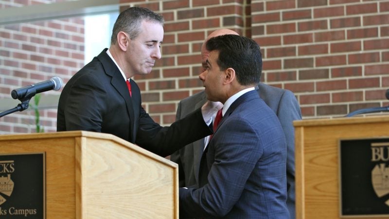 Republican congressional candidates, incumbent Brian Fitzpatrick (left) and Dean Malik, shake hands after a debate at Bucks County Community College. (Emma Lee/WHYY)