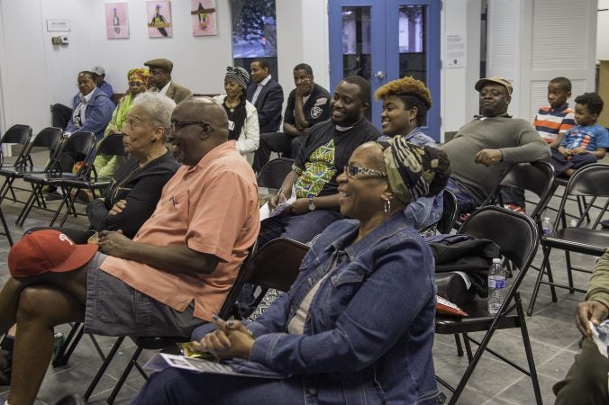 About two dozen people listen to community leaders discuss the legacy of Malcolm X. (Jonathan Wilson for WHYY)