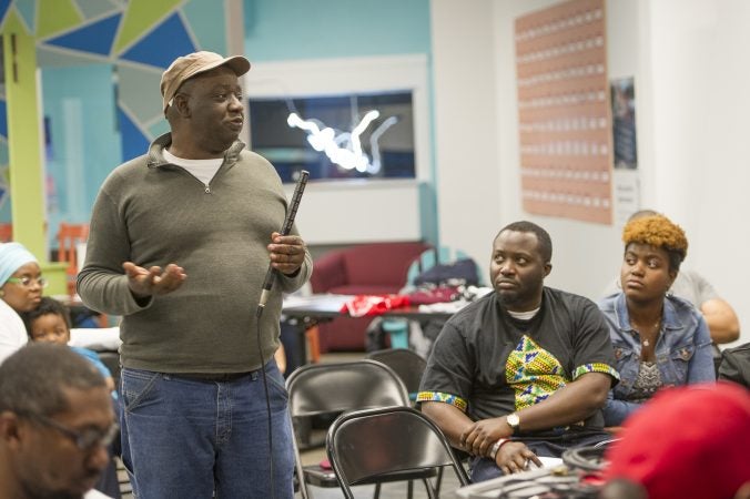 Abdul Salau shares his views with audience members and speakers. (Jonathan Wilson for WHYY)