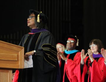 Keynote speaker Anita Hill receives a standing ovation at Rutgers Camden law school graduation. She also received an honorary doctor of law degree.