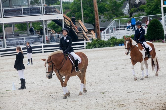 Competitors in the Therapeutic Riders Division ride in different formations at the Devon Horse Show. (Brad Larrison for WHYY)