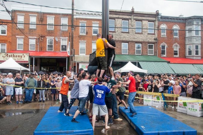 After the weather cleared the South Philly team made another attempt to climb the grease pole. (Brad Larrison for WHYY)