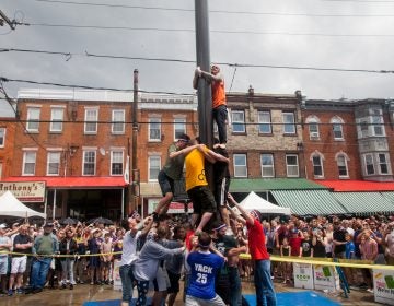 After the weather cleared the South Philly team made another attempt to climb the grease pole. (Brad Larrison for WHYY)