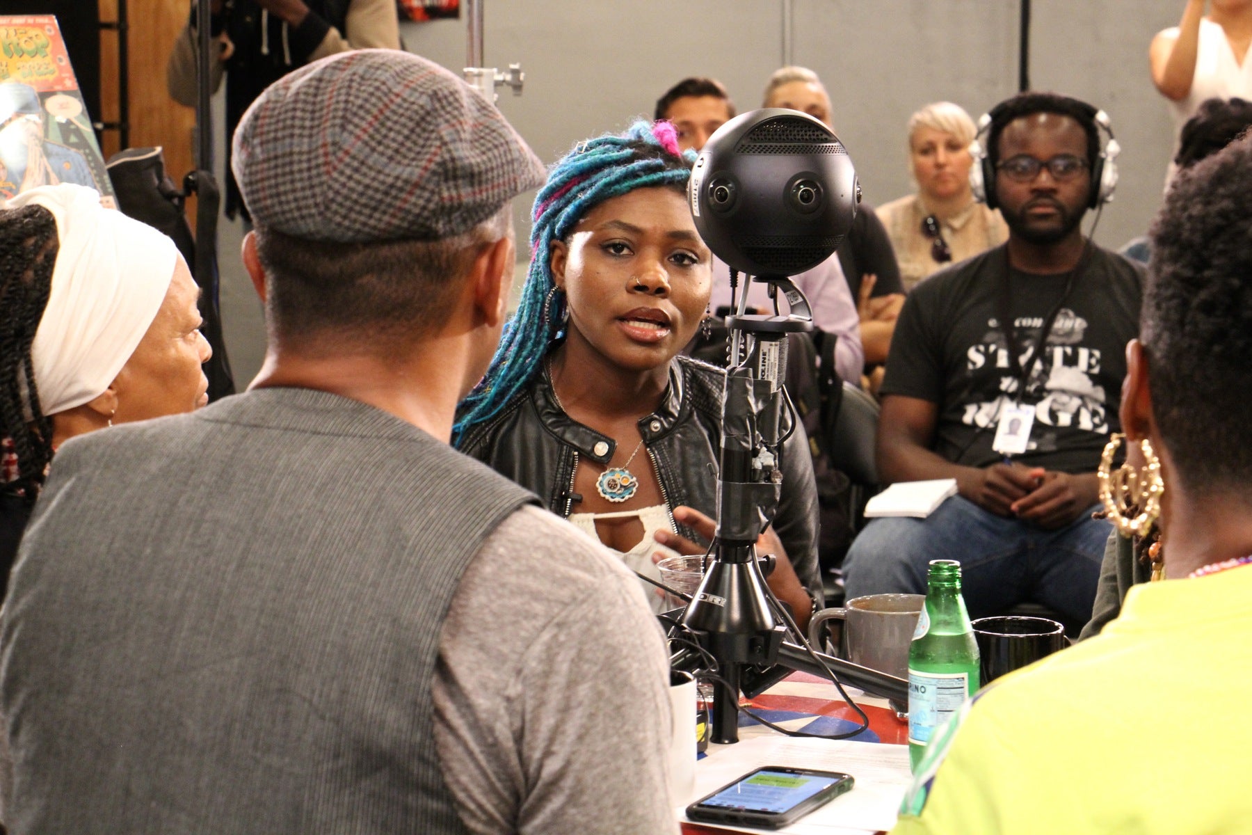 Amalgam Comics owner Ariell Johnson (center) participates in a roundtable discussion with other black coffeeshop owners focusing on how to boost black businesses and combat racism. 