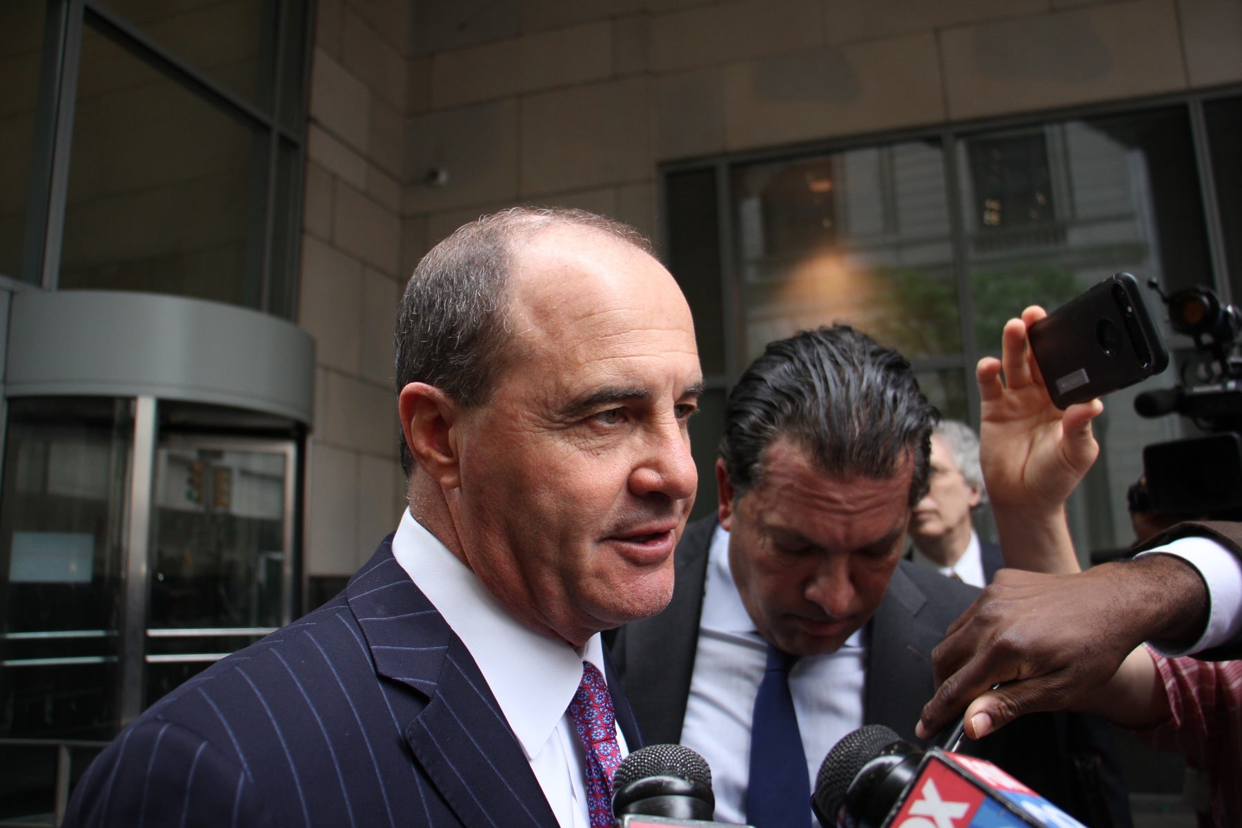 Meek Mill's lawyers Brian McMonagle (left) and Joe Tacopina talk with reporters after a hearing where they requested a new judge to oversee Mill's case. The request was denied.