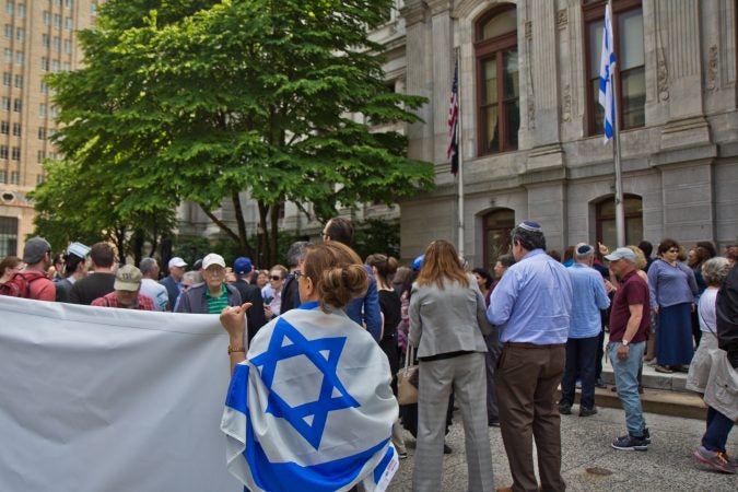 The flag of Israel is raised above City Hall in Philadelphia Monday. (Kimberly Paynter/WHYY)