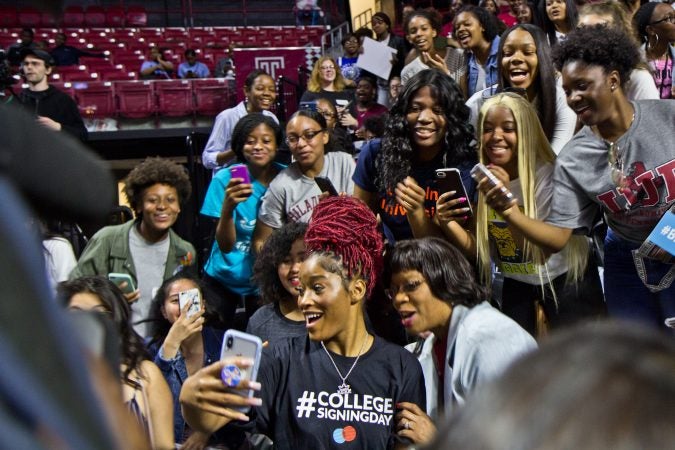 Actress Keke Palmer takes a selfie with college-bound seniors from Girls High School. (Kimberly Paynter/WHYY)