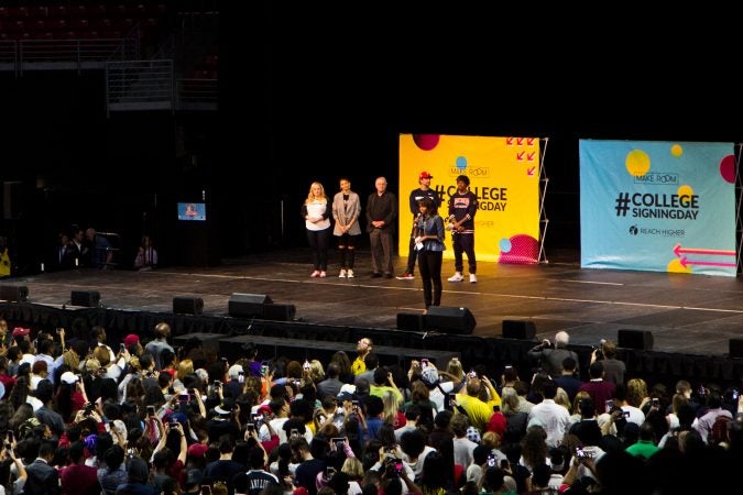 Former first lady Michelle Obama and other stars give encouragement and wise words to students at College Signing Day. (Kimberly Paynter/WHYY)