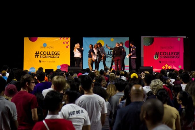 Philadelphia High School seniors take photos with Michelle Obama, Rebel Wilson, Robert De Niro, and Bradley Cooper. (Kimberly Paynter/WHYY)