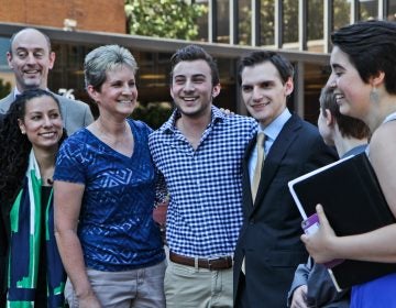 Aidan Destefano (center, checkered shirt) outside of the Philadelphia Federal Courthouse with his legal representation. (Kimberly Paynter/WHYY)