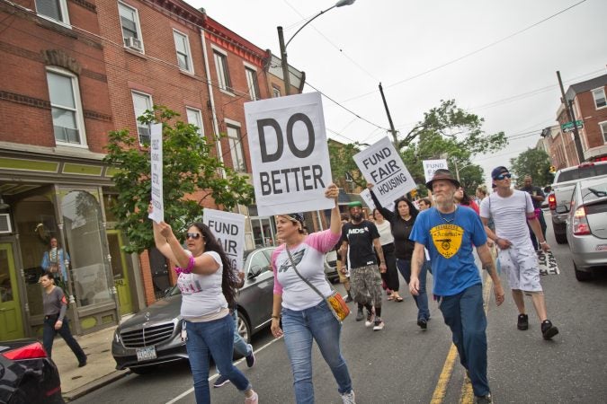 Protesters march down Frankford Avenue on the border of the Fishtown and Kensington sections of Philadelphia an hour before the city began removing people and their belongings from encampments in Kensington. (Kimberly Paynter/WHYY)