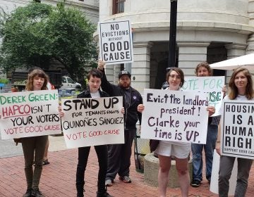 Calling on City Council to vote in favor of a bill requiring landlords to have just cause before evicting a tenant, demonstrators rally Thursday outside City Hall in Philadelphia. (Tom MacDonald/WHYY)