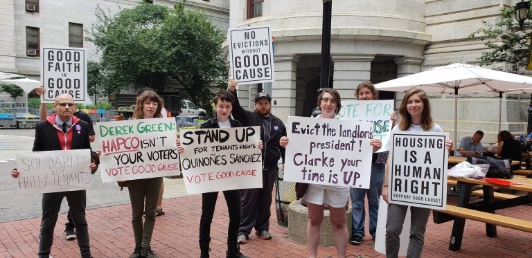 Calling on City Council to vote in favor of a bill requiring landlords to have just cause before evicting a tenant, demonstrators rally Thursday outside City Hall in Philadelphia. (Tom MacDonald/WHYY)