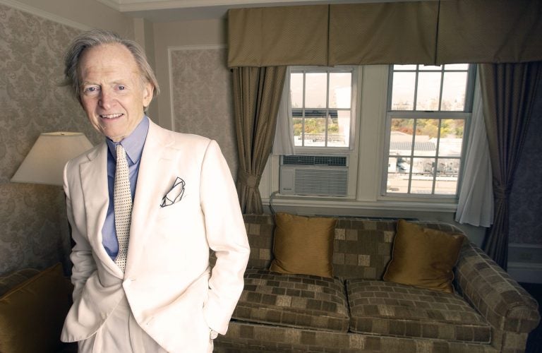 Author Tom Wolfe pauses for a photo during an interview at the Stanhope Hotel in New York on Nov. 2, 2004. (AP Photo/Jim Cooper)
