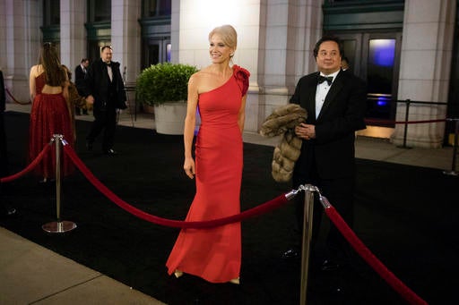 In this Thursday, Jan. 19, 2017 file photo, President-elect Donald Trump adviser Kellyanne Conway, accompanied by her husband, George, speaks with members of the media as they arrive for a dinner at Union Station in Washington, the day before Trump's inauguration. (Matt Rourke/AP Photo)