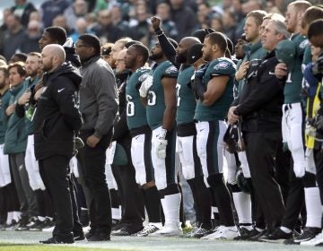 Philadelphia Eagles' Malcolm Jenkins, (center), gestures during the national anthem before an NFL football game against the Chicago Bears, Sunday, Nov. 26, 2017, in Philadelphia.