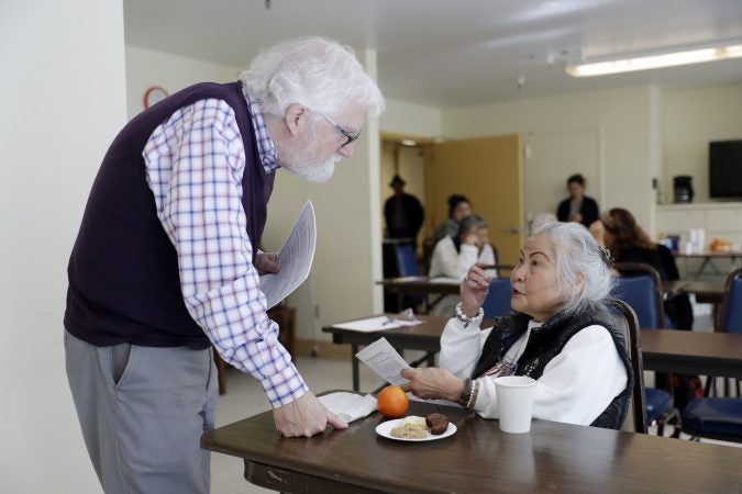 In this Friday, April 13, 2018 photo, Patrick Arbore, (left), talks to Corazon Leano as he conducts an anti-bullying class at the On Lok 30th Street Senior Center in San Francisco. Nursing homes, senior centers and other places older adults gather are confronting a problem long thought the domain of the young: Bullying. (Marcio Jose Sanchez/AP Photo)