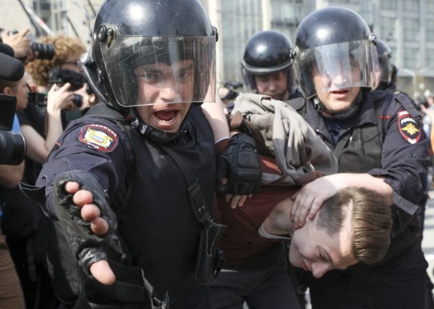 Russian police detain a protester at a demonstration against President Vladimir Putin in Pushkin Square, Moscow, Saturday May 5, 2018.  Police arrested hundreds, including protest organizer Alexei Navalny, the anti-corruption campaigner who is Putin's most prominent foe. (AP Photo)