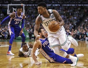 Boston Celtics guard Marcus Smart, right, drives past Philadelphia 76ers guard Marco Belinelli during the first quarter of Game 5 of an NBA basketball playoff series in Boston, Wednesday, May 9, 2018. (AP Photo/Charles Krupa)